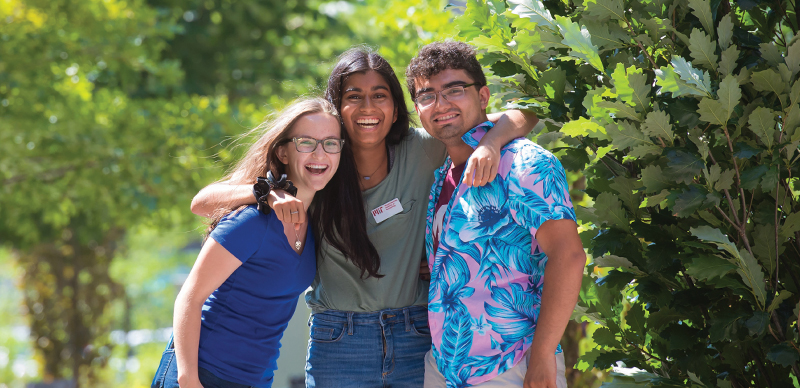 Three tour guides standing together