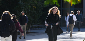 Girl riding on an electric scooter around MIT campus.